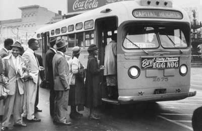 African Americans boarding through the front of a bus