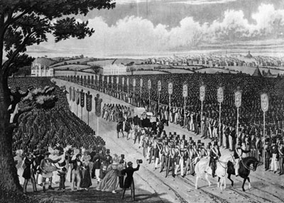 Crowd of workers with factory in the background
