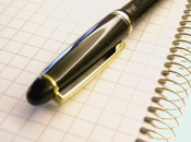 Graph paper notebook with pen