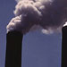 smoke coming out of a factory smokestack