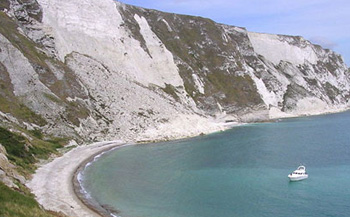 Picture showing large amounts of soil that have slid down the side of a cliff. 