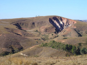 headward erosion, with deep valleys being cut upslope into a mountainside