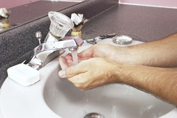 A person washing their hands