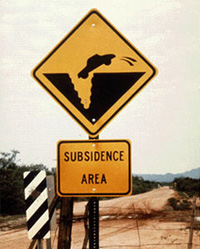 A sign warning motorists of the hazard of land subsidence