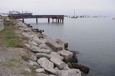 large rocks piled up along a shoreline