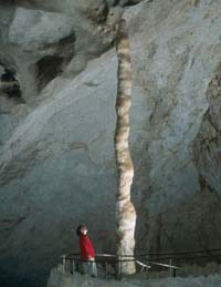 a large stalagmite in a cave