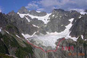 A glacier inside a bowl-shaped depression on the side of a mountain.