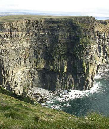 steep, jagged cliffs along the shore