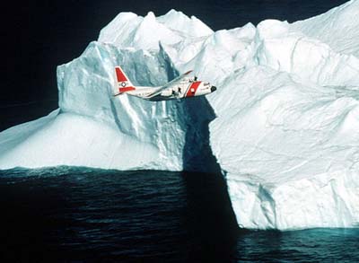 a patrol plane near a large iceberg