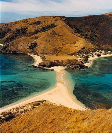 a long build-up of sand connecting two islands to each other