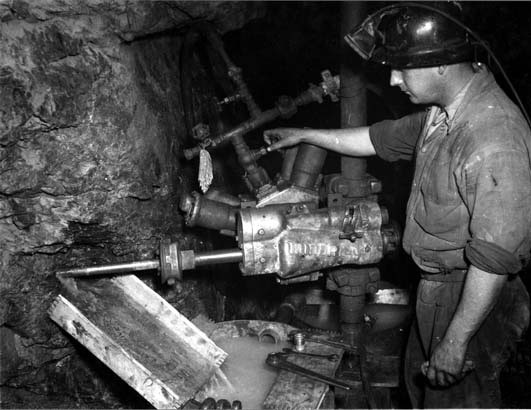 miners in a hard rock mine