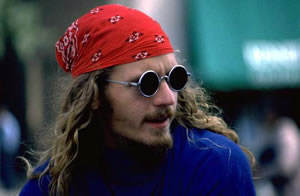 A Young man with long hair and a bandana
