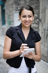 Teen girl writing in a notebook.