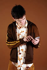 A teen boy texting