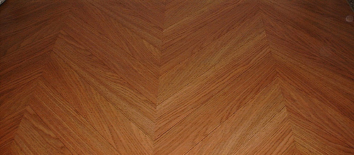 wood floring laid in a herringbone pattern