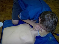 Person giving CPR to a dummy