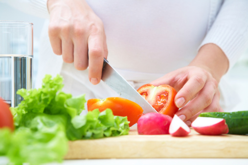 cutting up vegitables on a cutting board