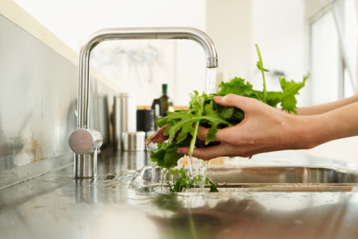 washing leafy green vegitables in the sink