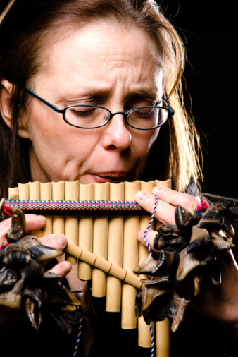 woman playing pan pipes