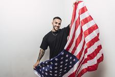 young man holding US Flag