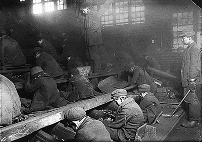 Young boys working in a factory