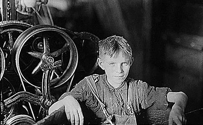 Young boy working in a factory