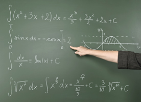 A hand pointing to a math equation on a chalk board; ThinkStock.com