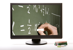 Math equations written on a chalkboard displayed via a laptop screen; ThinkStock.com