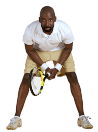 A person wearing athletic attire getting ready for a tennis match; Shutterstock.com