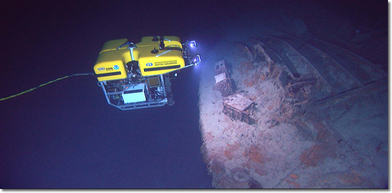 ROV Hercules investigating boxes on the stern of RMS Titanic more than two and a half miles deep during NOAA’s 2004 expedition to the wreck site. NOAA’s new ship will have a similar ROV operating on a tether of about 90 feet from an ROV tow sled positioned deep in the ocean. Source: IFE/ URI /NOAA