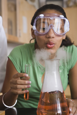 Teenage girl performing science experiment