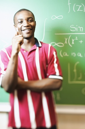 A student in front of a chalkboard