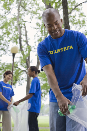 Volunteers picking up trash in park