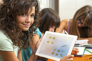 A female student using a touchpad to engage in mathematical concepts