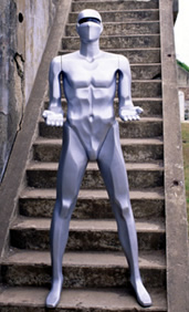 A robot standing on stone steps.