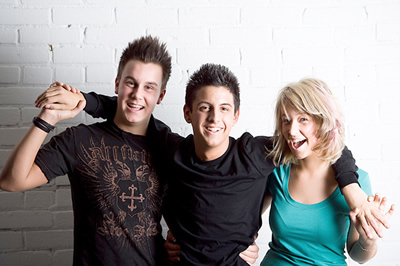 Three smiling teens.