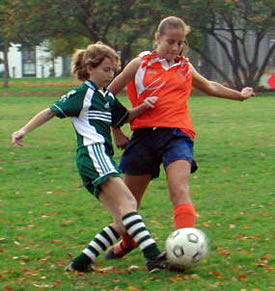 Girls playing soccer.