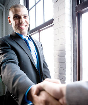 Man shaking hands and smiling