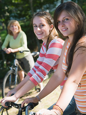 Teen girls bicycling