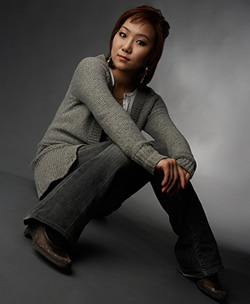 Serious-looking young woman sitting down