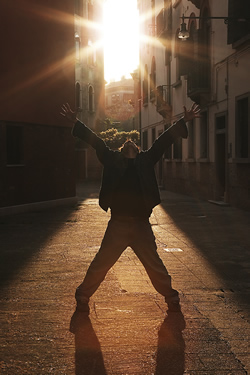 Man celebrating in the sunshine