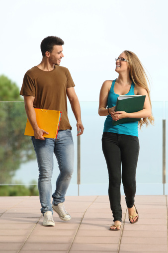 young male and female student talking