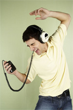 a man dancing while listening to head phones