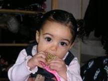 child putting object in mouth